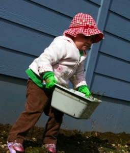 Taking the weeds to the compost.